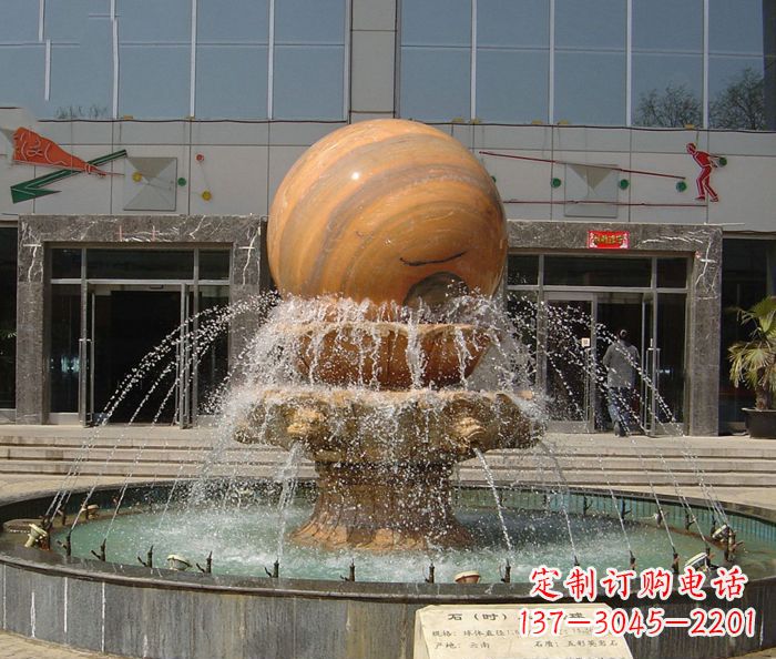 内江石来运转球晚霞红风水球石雕